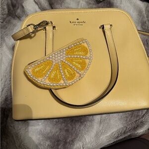 Kate Spade Patterson Drive Pebbled Emboss
Bag in Butter. With lemon coin purse
